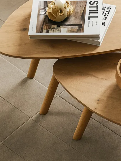 A closer look at the craftsmanship of the nested tables, showing the grain of the wood and the clean joinery of the legs. This piece is designed to be both beautiful and durable, perfect for everyday use.