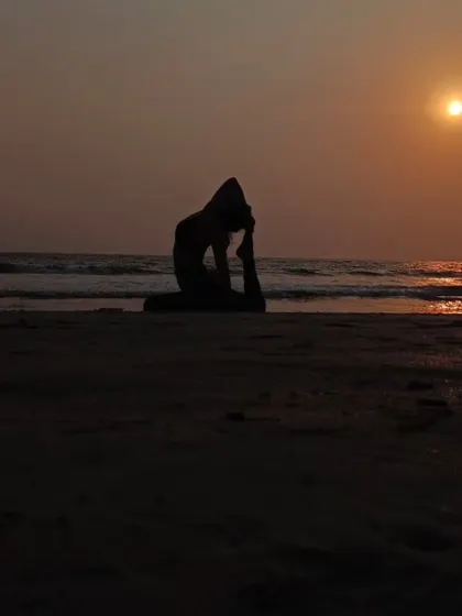 A silhouette of a deep backbend against the setting sun. Moments like these, where movement meets nature, are what make life beautiful.