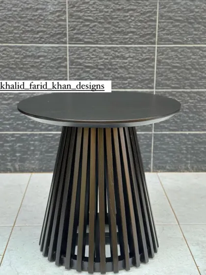 Another angle of the black slatted table.