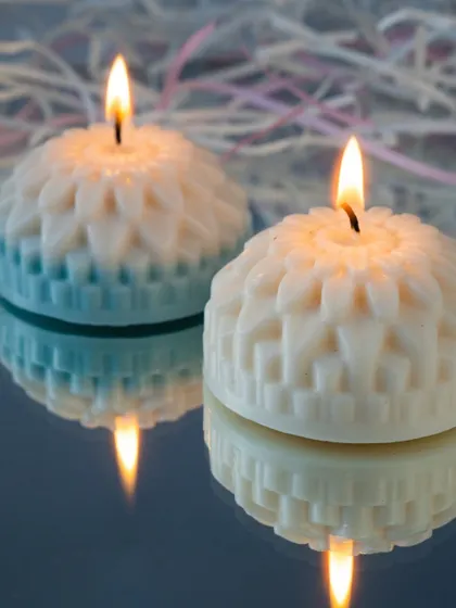 Our dual-toned flower candles lit up, reflecting beautifully on the surface. They add a touch of modern art to your decor.