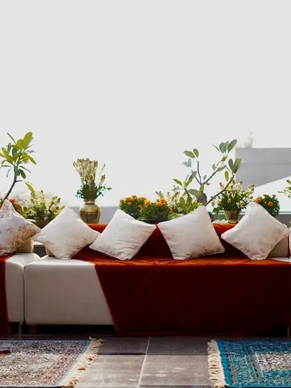 A wider view of the comfortable and stylish lounge area, perfect for guests to relax and enjoy the outdoor setting.