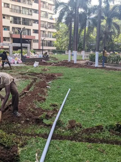 Our team digs trenches across an existing lawn to install a new, more efficient sprinkler system.