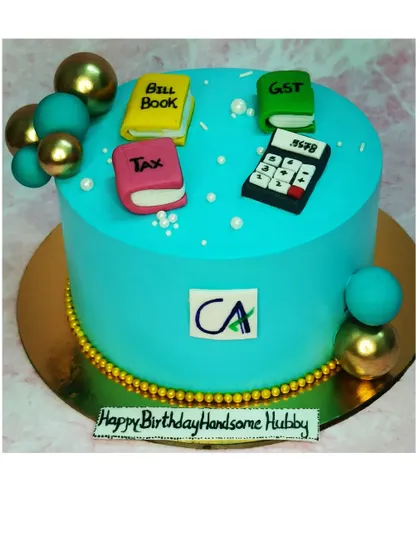 A cake for a Chartered Accountant, decorated with fondant tax books and a calculator. This is a chocolate roasted almond flavor.