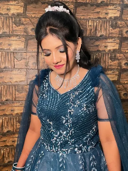 Another angle of the bride's engagement look, showing the delicate details of her hair accessory.