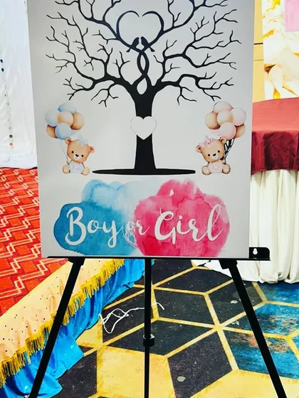 A fun addition to a baby shower or gender reveal party. This easel holds a 'Boy or Girl' themed canvas with a fingerprint tree, allowing guests to participate in a memorable activity.