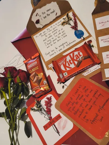 An open view of the anniversary hamper, showing the handwritten notes and thoughtful details inside.
