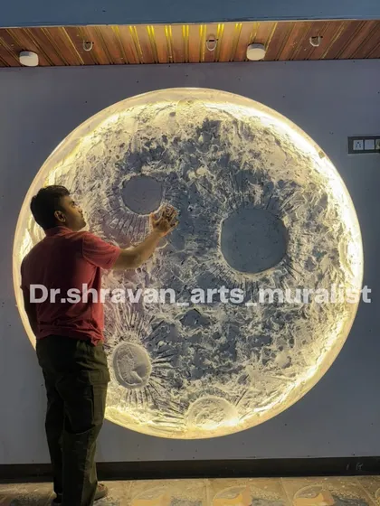 Here I am adding the final touches to a large, enchanting moon mural in Bangalore. The built-in LED lighting makes the textured surface glow, turning the wall into a major feature of the room.