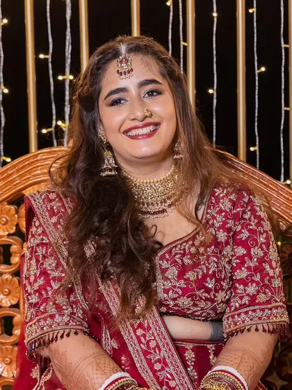 A candid shot of the bride, laughing and enjoying her reception. The makeup is designed to last all night while still looking fresh.