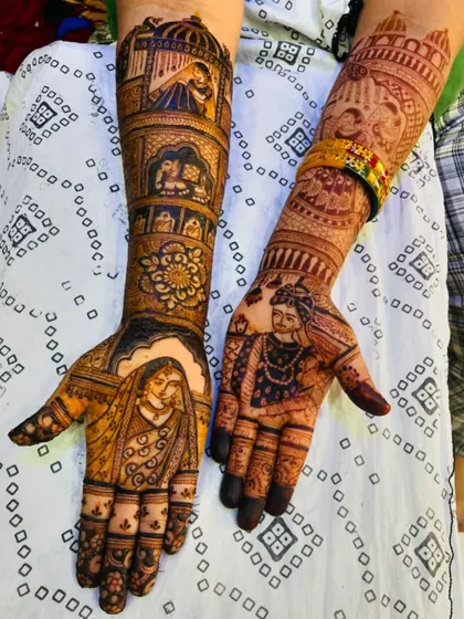 A stunning bridal mehendi featuring portraits of a Maharashtrian bride and groom. The design also includes traditional elements like the doli and kalash, making it a complete wedding story.