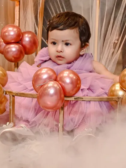 Happy first birthday to this little princess! Capturing the wonder and joy of milestone celebrations like this is what I live for. Look at her enjoying her beautiful birthday setup.