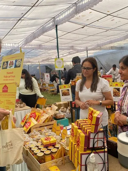 It brings me so much joy to meet customers at my market stall. Here I am with journalist Ravish Kumar, who stopped by to try some of my homemade treats. Moments like these make all the hard work feel so rewarding.
