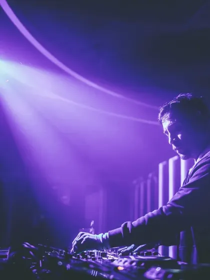 A spotlight on me during my set in Siliguri. The purple haze and focused light created a dramatic, atmospheric moment.