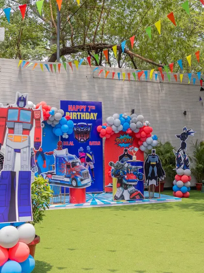 A superhero-studded birthday with a massive Transformers backdrop. Our spacious lawn is perfect for setting up large, impactful decorations for an action-packed party.