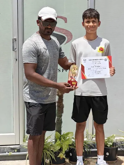 A coach presenting the finalist trophy to Svar. We believe in learning from every match, win or lose.