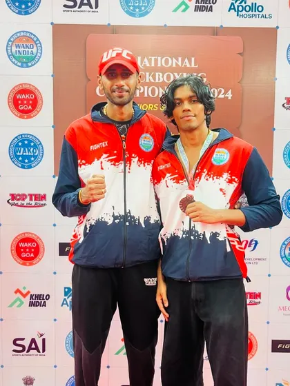 Two of our fighters at the national kickboxing championship. One team, one family, supporting each other in victory.