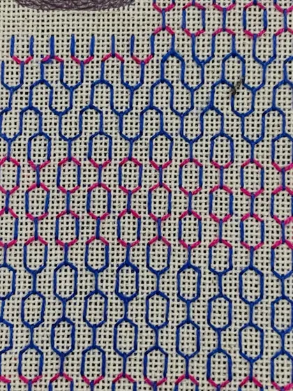 The phone insert partway through the stitching process. You can see how the pattern is built up row by row.