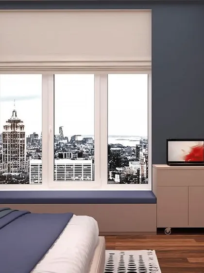 This bedroom features a large window with a city view, a cozy window seat, and a movable side table for ultimate flexibility.