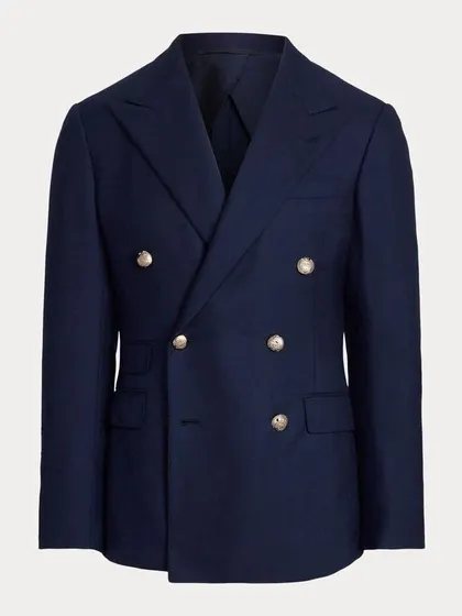 A classic navy double-breasted blazer with gold buttons. This is a timeless piece that captures the spirit of the individual who wears it.