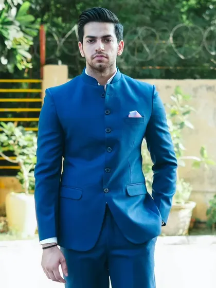 A full shot of the royal blue Jodhpuri suit, showing its sharp silhouette. It's a powerful look for any man.