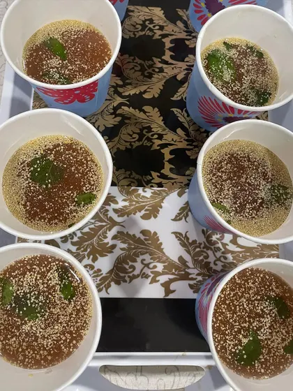 A tray of refreshing Beetroot Kanji ready to be served. It's a traditional, healthy, and delicious way to stay cool during the summer months.