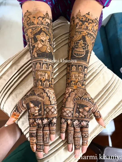 This full-arm design is a tribute to faith, featuring a large portrait of Lord Ganesha, a traditional kalash, and scenes from a wedding procession. It’s a masterpiece of spiritual and bridal art combined.