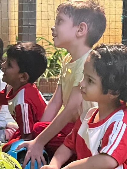 The attentive, upward gaze of the children shows the connection and respect they have for their coach. We foster an environment of mutual respect.