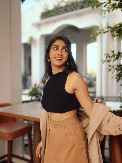 A candid, laughing shot that brings personality and life to the fashion image.