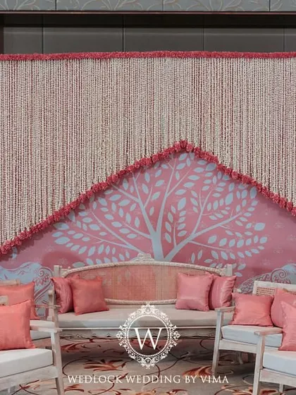The stunning final stage for the half-saree function. Our meticulous planning and 3D visualization ensured that every element, from the floral chandeliers to the custom backdrops, was executed perfectly.