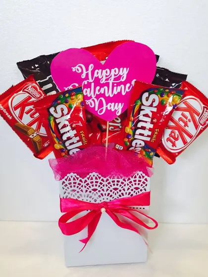 For the one with a sweet tooth, a simple and cute Valentine's bouquet made entirely of KitKats and Skittles.