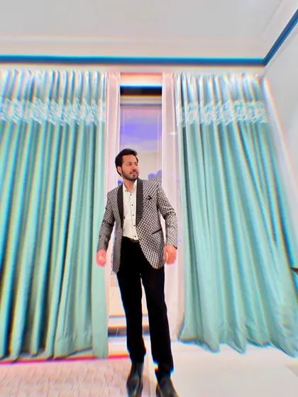 A full-length shot of me in a patterned blazer, looking ready and poised for action.