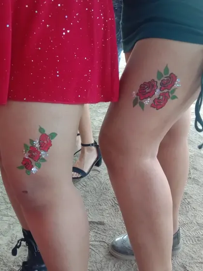 Matching rose tattoos for friends. I can create custom designs for groups who want to share a piece of temporary art.