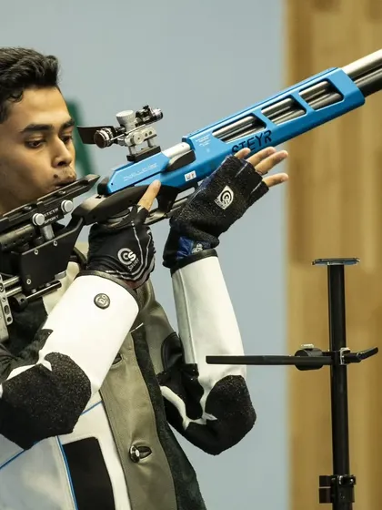 An Indian rifle shooter in perfect form during an international competition. These athletes set the standard for excellence.