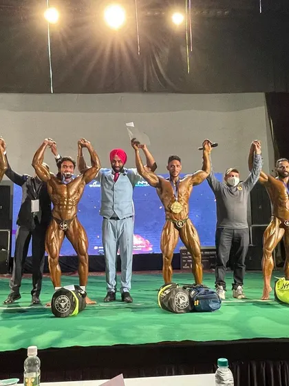On stage at the Aman Classic, winning two silver medals.