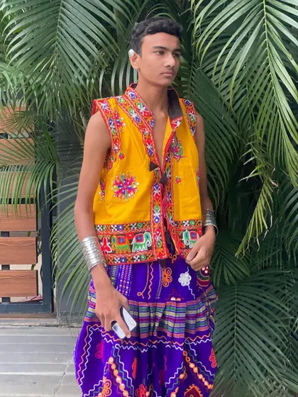 A full-length view of the yellow jacket and purple dhoti pants, a comfortable and stylish option for men who want to stand out.