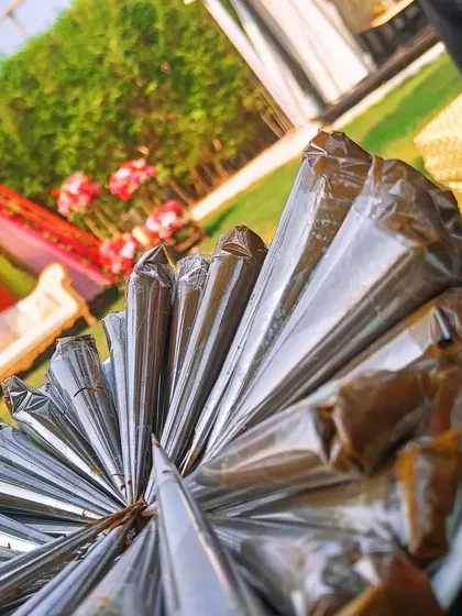 A fresh batch of my handmade henna cones, ready for an event in Alibag. Each cone is filled with my signature all-natural paste, ensuring a smooth flow and a rich, dark stain for any occasion.