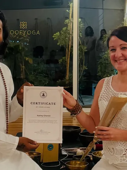 Presenting a certificate to a student in Casablanca. This moment marks her readiness to begin her practice and help others heal.