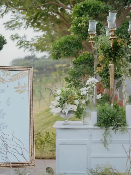 The welcome setup for the evening, where a beautifully framed sign and elegant floral arrangements greeted guests, setting the tone for a night of love and laughter.