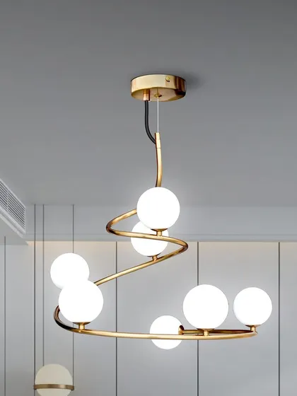 A spiral globe chandelier that offers a playful and modern aesthetic. This piece is perfect for a living room or a creative office space.