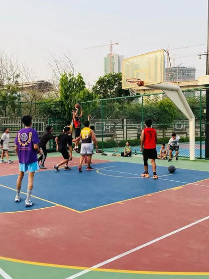 A player elevates for a jump shot over the defense in an evening scrimmage.