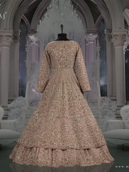 The back view of the onion pink Indo-Western outfit, showcasing its intricate design and premium tissue silk fabric.