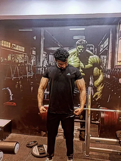 My cousin's son is standing behind me. A humorous take on the Hulk mural.