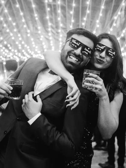 The same fun moment in black and white. It gives the cocktail party photo a classic, timeless party vibe.