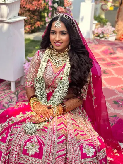A candid shot of the bride at her wedding, looking joyful and radiant.