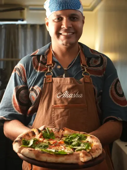 Me with one of my contemporary Neapolitan style pizzas. This is more than a job for me; it's a passion I love sharing at house parties and events across Mumbai.