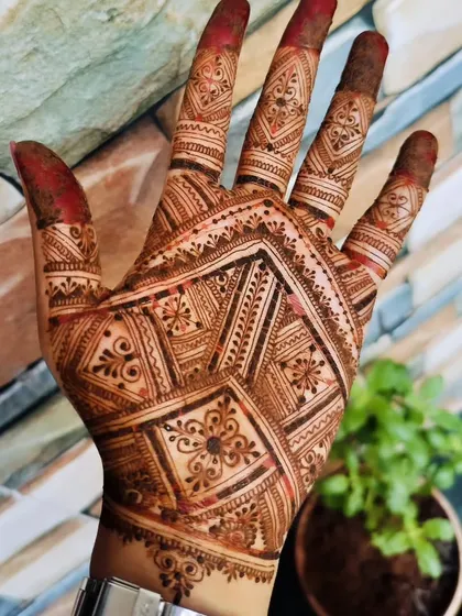 The same geometric design after the stain has fully matured, showing a deep, rich color.