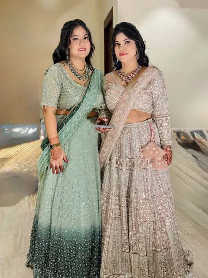 Another shot of the two sisters, showing their coordinated looks.