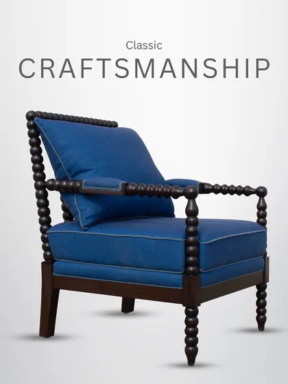 Classic craftsmanship shines in this wooden armchair, a piece that combines traditional techniques with modern comfort.