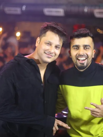 A duplicate of the happy B2B photo. The positive energy between performers is contagious and spreads to the crowd.