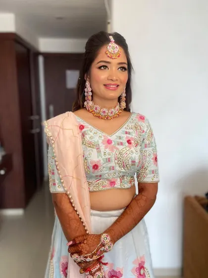 The complete look is a perfect vision of a modern mehendi bride, full of color and joy.