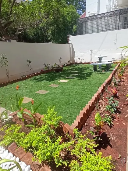 A view of a newly planted garden. We use a mix of flowering plants, shrubs, and ornamental grasses to create layers of texture and color that will mature beautifully over time.